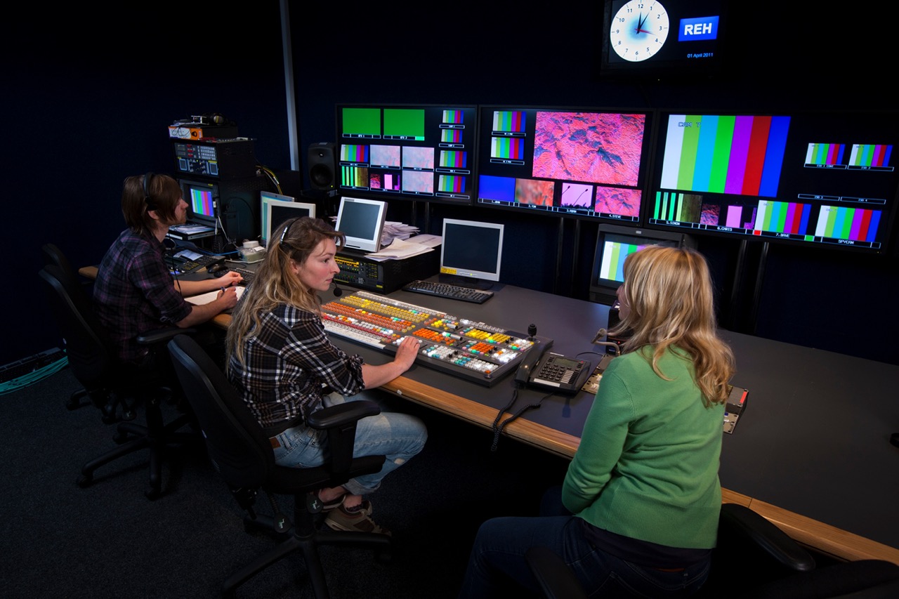 TV Director talking to her Vision Mixer in a Television Gallery.